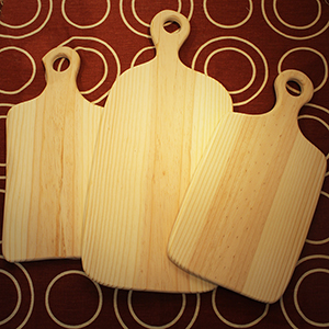 photo de trois planches à découper en bois